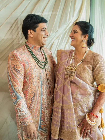 Styling isn't just for the bride and groom. I had a wonderful time creating these coordinated looks for the parents. The father's paisley print sherwani and the mother's elegant saree with statement jewelry created a sophisticated and unified look for the wedding day.