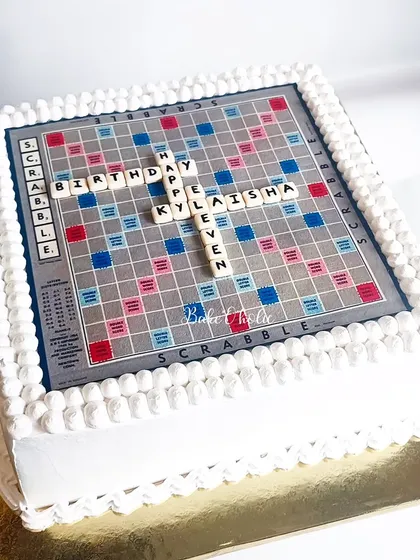 A Scrabble board cake for a board game lover's birthday. This 3kg Blueberry-Lemon cake features an edible print of the board and personalized letter tiles.