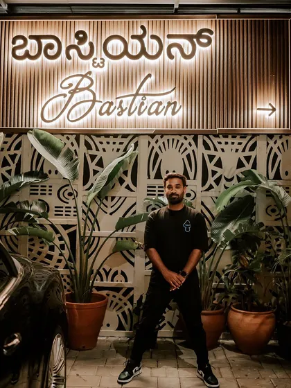 When I'm not behind the decks, I'm soaking in the city's vibe. Here I am at Bastian, one of Bangalore's cool spots, always staying connected to the nightlife scene.