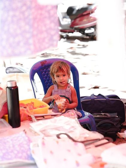 The youngest generation of artisans. This little one is right at home amidst the creativity and bustle of the market.