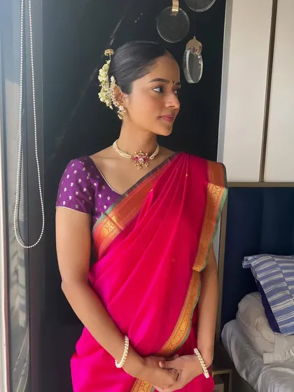 A portrait of the beautiful Maharashtrian bride, her hair styled in a classic, elegant updo.