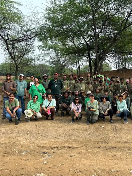 A group photo of our team, rewilding experts, and volunteers after a fabulous day of planting at a mined-out quartzite pit in Aravali Nagar Van.