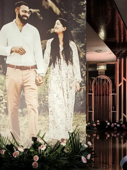 Making the decor all about the couple. A life-sized photo stands at the entrance, creating a warm and personal welcome for guests arriving at the reception.