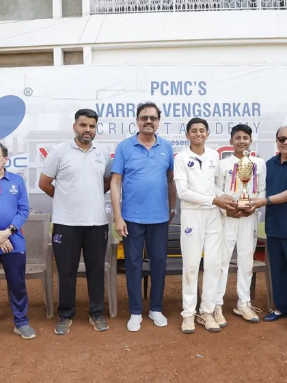 The victorious captains of the Varroc Vengsarkar Cricket Academy team with the U-15 trophy.