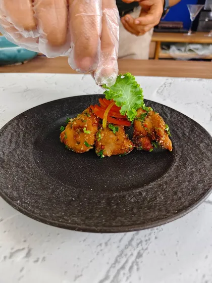 Experience the magic in order: crunch first, then spice, and finally the melt-in-your-mouth fish. That's the journey of our Kerala-style podi fish cakes.