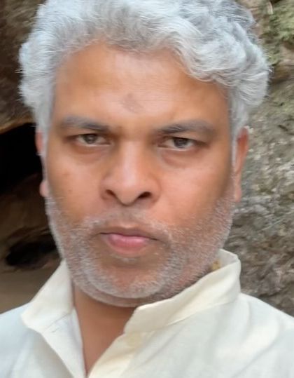 A moment of quiet contemplation near Babaji's cave. Being in such a spiritually charged place is a reminder of the deeper purpose behind all our worldly actions.