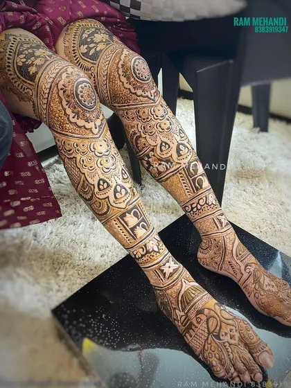 My full bridal packages include intricate designs for the legs, extending from toes to knees. This design features detailed floral and geometric patterns, ensuring a complete and stunning bridal look.