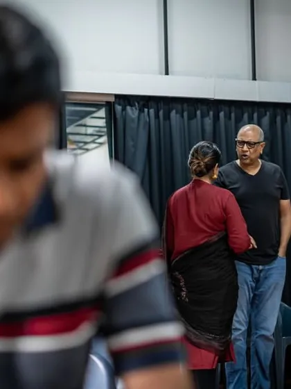 A tale of two pictures. This rehearsal photo for "Kone Galige" plays with focus, hinting that what you think is important might be a distraction from the real story.