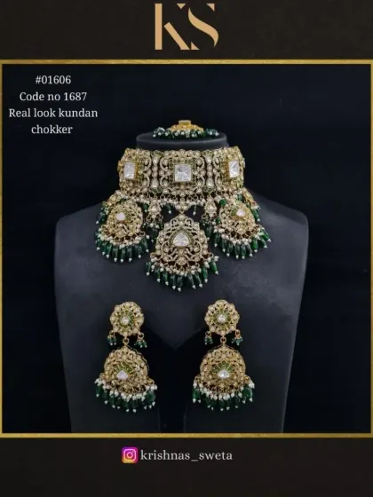 The same real-look Kundan choker set, shown here with emerald green bead drops. This classic color combination is always a favorite for bridal wear.