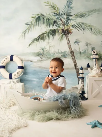 Pure joy on this little sailor's face! His clapping hands and big smile make this a wonderfully candid moment.