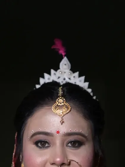 A close-up, artistic shot focusing on the traditional 'mukut' of a Bengali bride. This highlights my specialization in capturing the unique cultural details and accessories of regional weddings.