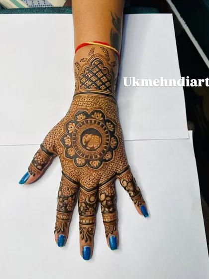 The elephant motif is a classic, and I love giving it a central place in a beautiful mandala design. This style is perfect for festivals, filled with delicate patterns but still feeling open and elegant. It shows how I can make a single motif the star of the show.