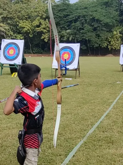 A young archer prepares to shoot at the SFA Archery Championship in Mumbai. Competitions are a great learning experience, teaching sportsmanship and performance under pressure.