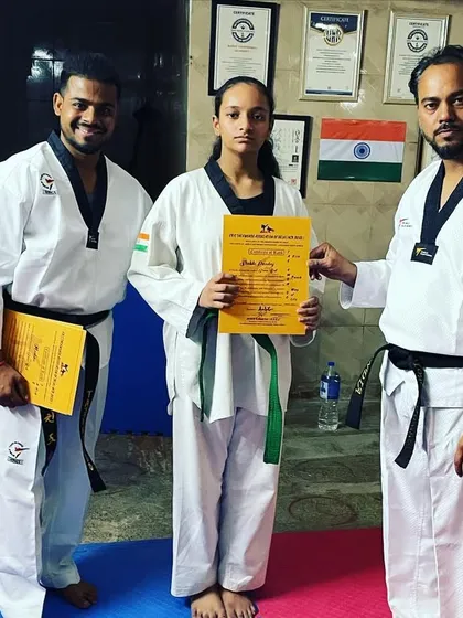 This dedicated student has successfully passed her belt test. Her certificate is a symbol of her commitment and growing skill.