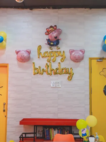 Simple yet festive Peppa Pig themed wall decor. We use foil balloons and character cutouts to decorate different areas of our venue, ensuring the party atmosphere is felt everywhere.