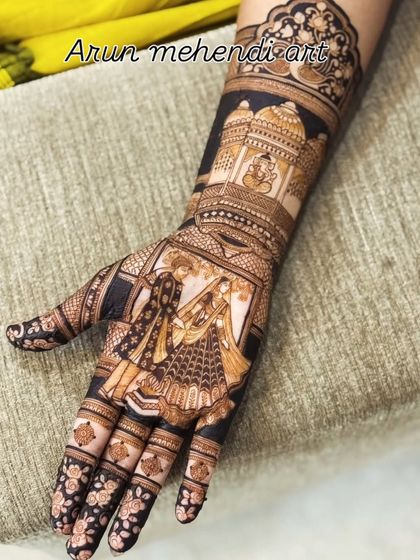 A single hand design with a beautiful portrait of a couple exchanging varmala, with Ganesha watching over them.