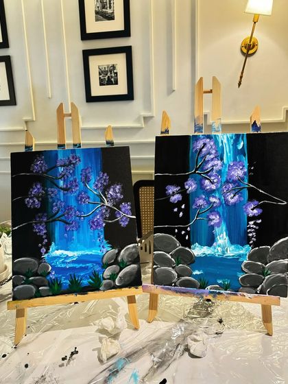Two canvases displaying a waterfall scene with purple flowers, showing how the same subject can be interpreted differently.