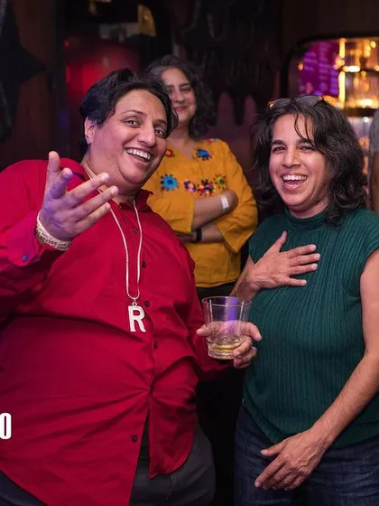 A candid moment from a Bollywood Disco party. These events are more than just a DJ set; they are interactive celebrations where people can connect with the music and each other in a joyful, chosen-family atmosphere.