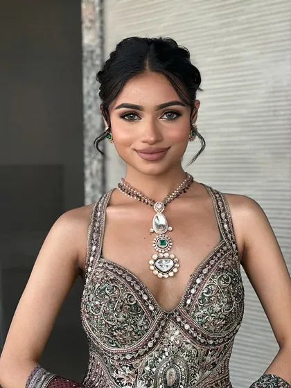 The final look is fresh and radiant. This makeup is designed to last through all the festivities of a Mehendi ceremony.