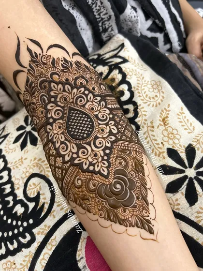 A more elaborate version of the paisley motif for Afreen, with additional floral and swirl details.
