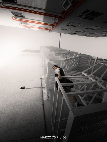 Playing with light and shadow for an urban photoshoot. This dramatic, low-angle shot was taken on the Narzo 70 Pro 5G.