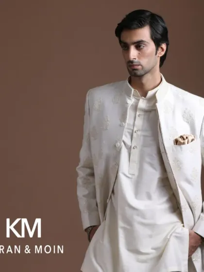 This off-white open jacket layered over a kurta is more than just fabric. It's a statement of heritage, pride, and a new story, perfect for the man who values culture.