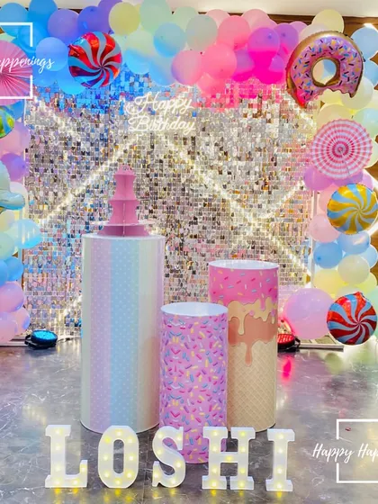 The full Candyland stage setup before the guests arrived. The combination of the sequin wall, candy-themed props, and light-up letters creates a truly magical and inviting scene.
