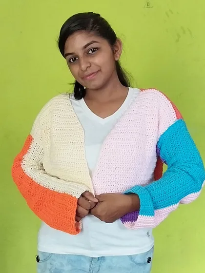 Beyond accessories, I also craft cozy, wearable pieces like this multicolored pastel cardigan. I can customize the colors and size to create the perfect statement piece for your wardrobe.