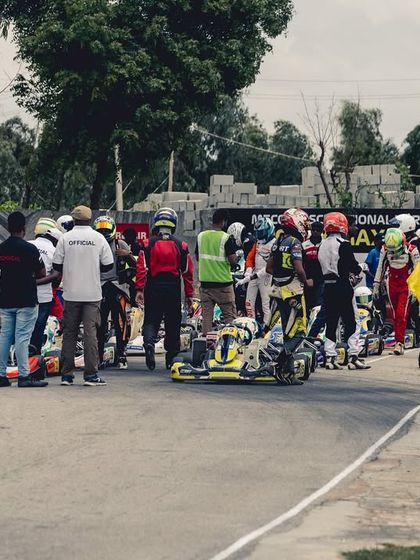 The grid before a race at the RMC, with drivers and teams making final preparations.