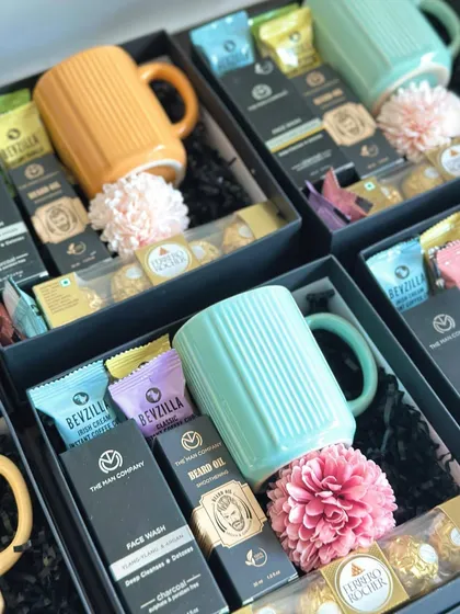A great mix of practical and fun for the groomsmen. This hamper includes a face wash and beard oil from The Man Company, a bright mug, coffee cubes, and chocolates.
