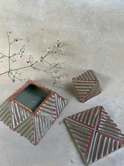 A closer look at the hand-carved details on the pyramid boxes from the KHUMĀR collection, before they are glazed and fired.