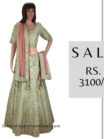 A graceful pastel green lehenga with a pink dupatta, on sale for Rs. 3100. A great addition to your ethnic wardrobe.