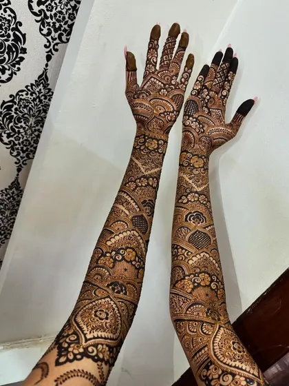 A shot of both arms, showing the symmetry and the beautiful back-of-hand design.