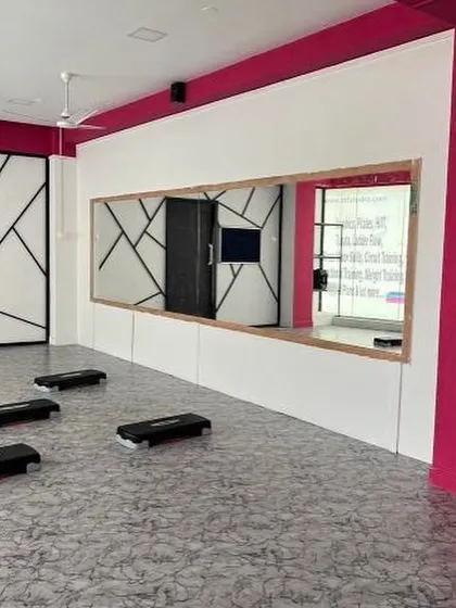 A look inside our women-only fitness studio. We've created a clean, modern, and judgment-free space with all the equipment you need, including steppers for our signature aerobics classes. This is your safe space to focus on yourself.