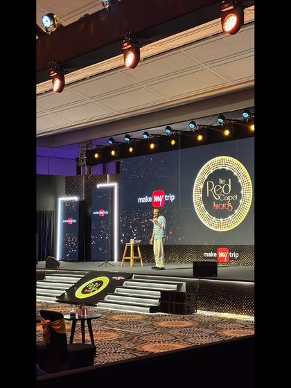 An entertainer on stage at the MakeMyTrip Red Carpet Awards. Our artist and stage management services ensure that entertainment segments are a highlight of the evening.