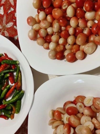 These are fresh Karonda berries and green chillies, ready to be turned into a tangy and unique pickle. Karonda is a sour berry that is full of Vitamin C.