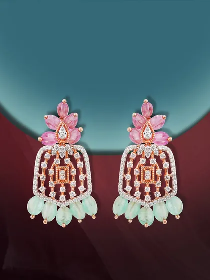 Rose gold glows, diamonds whisper, and colors sing. These 'Pride of the Bride' earrings capture the essence of her story, featuring pink and green gemstones in a radiant, celebratory design.