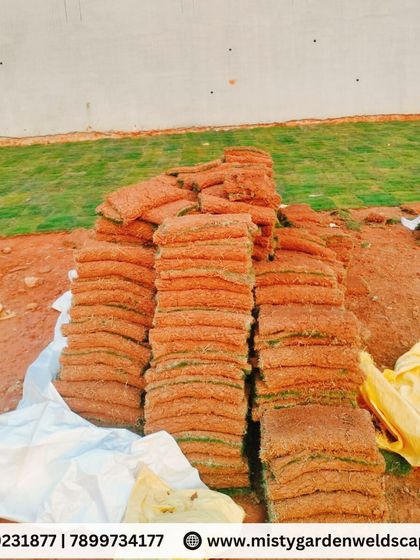 Stacks of fresh Mexican grass turf ready to be installed. We source high quality materials to ensure a healthy and long lasting lawn for our clients.