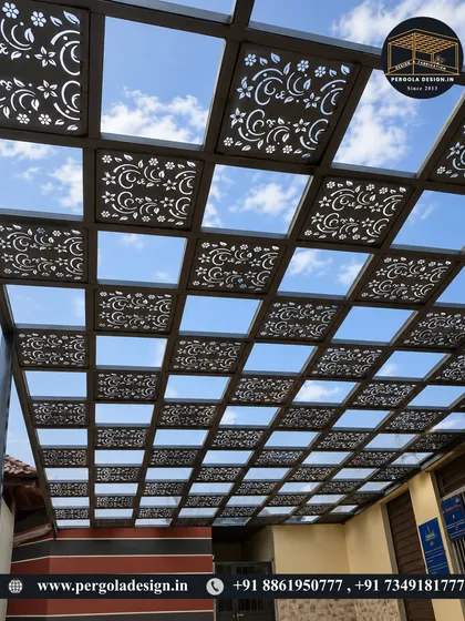 Here is another example of our custom laser-cut roofing panels. This floral and vine pattern offers a softer, more organic aesthetic compared to geometric designs. It creates a beautiful dappled light effect on the ground below, mimicking the shade of a tree.
