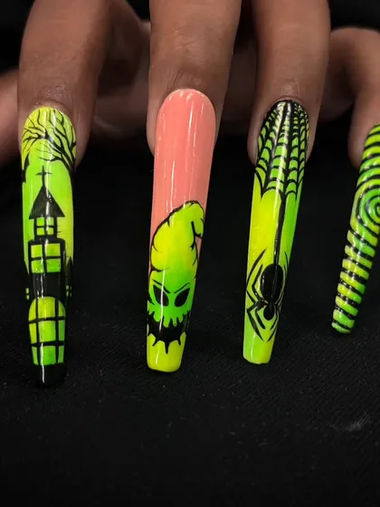 A full view of the hand with the neon Halloween nails, showing how all the different spooky elements come together.