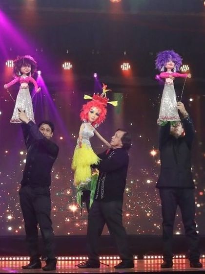 Another shot of the fairy puppet performance, showing the coordination required from the team of puppeteers.