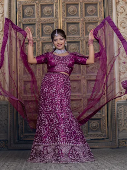 A playful shot with the dupatta, adding movement and life to the photo.