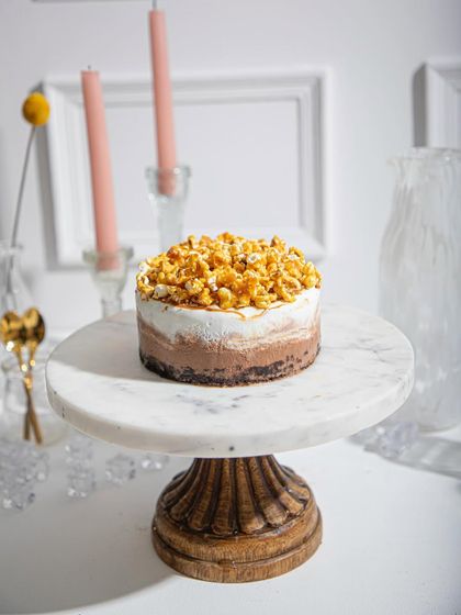 Our caramelised popcorn and milk chocolate ice cream cake, a delightful mix of sweet, salty, and crunchy textures.