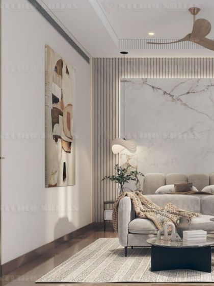 This angle highlights the soft, natural light and the calm, neutral color scheme of the DLF Gurgaon bedroom.