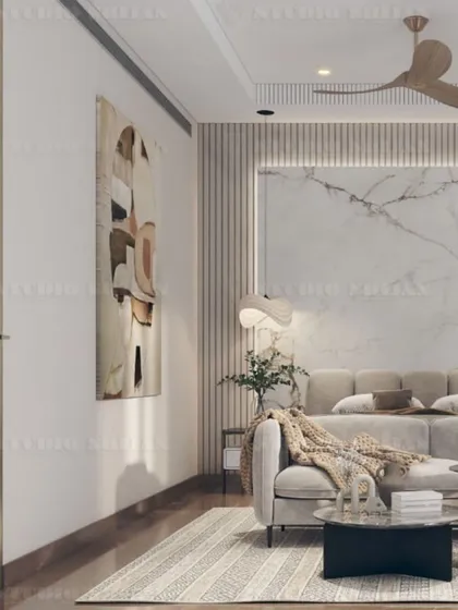 This angle highlights the soft, natural light and the calm, neutral color scheme of the DLF Gurgaon bedroom.