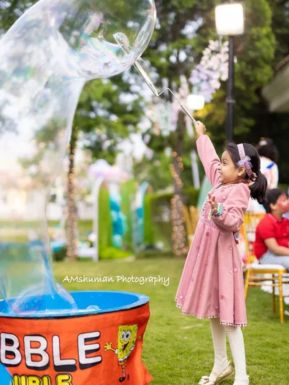 The best parties are filled with moments of pure wonder. I love incorporating fun activities that fit the theme, like this giant bubble station that brought so much joy and laughter to this magical outdoor celebration.