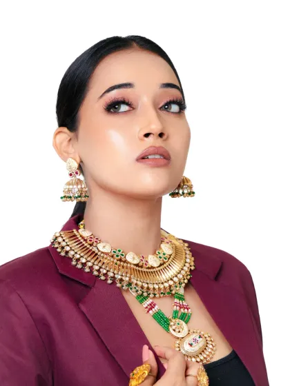A confident pose showing off the full set of traditional jewelry with a modern blazer. This highlights the versatility of ethnic accessories.