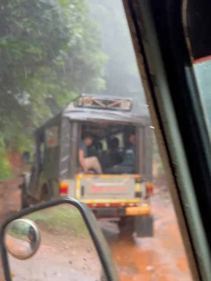 An off road jeep ride on a muddy trail, a common and thrilling part of reaching remote trek base points during the monsoon.
