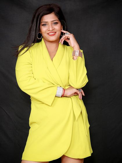 A full-length view of the yellow wrap dress, showing how it fits and moves. This is a key shot for any apparel brand.