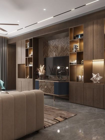 Functionality meets luxury in this family room's entertainment and display unit. We designed this full-wall custom cabinetry with integrated lighting to beautifully showcase art pieces and awards, while neatly housing the media center.